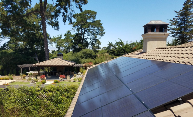 Image showing residential home w/ solar array on roof